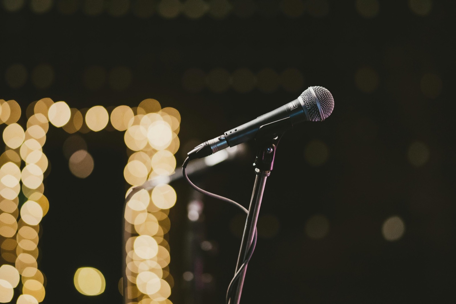 Stage microphone and lighting rig set up for a live event